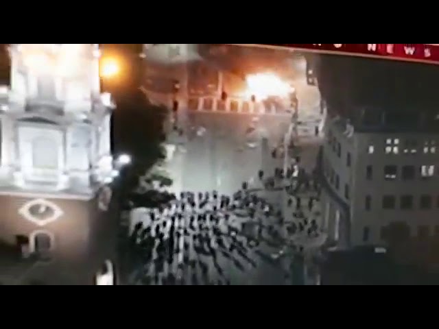 Boston Police vehicle being burned.